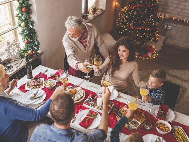 High Angle View Of A Beautiful Happy Family Gathered Around The