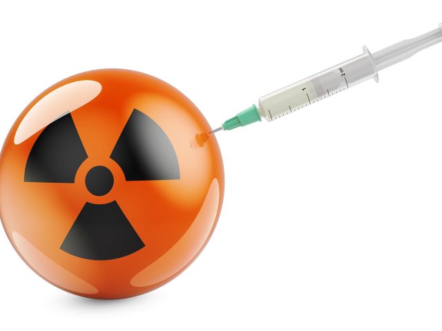Syringe with radiation symbol flag