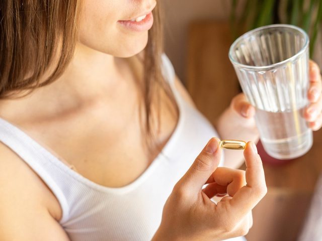 Healthcare, Treatment, Supplements. Happy Smiling Woman Taking P
